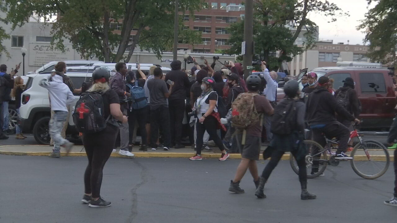 Protesters gather in a parking lot in downtown Louisville 9/24/20